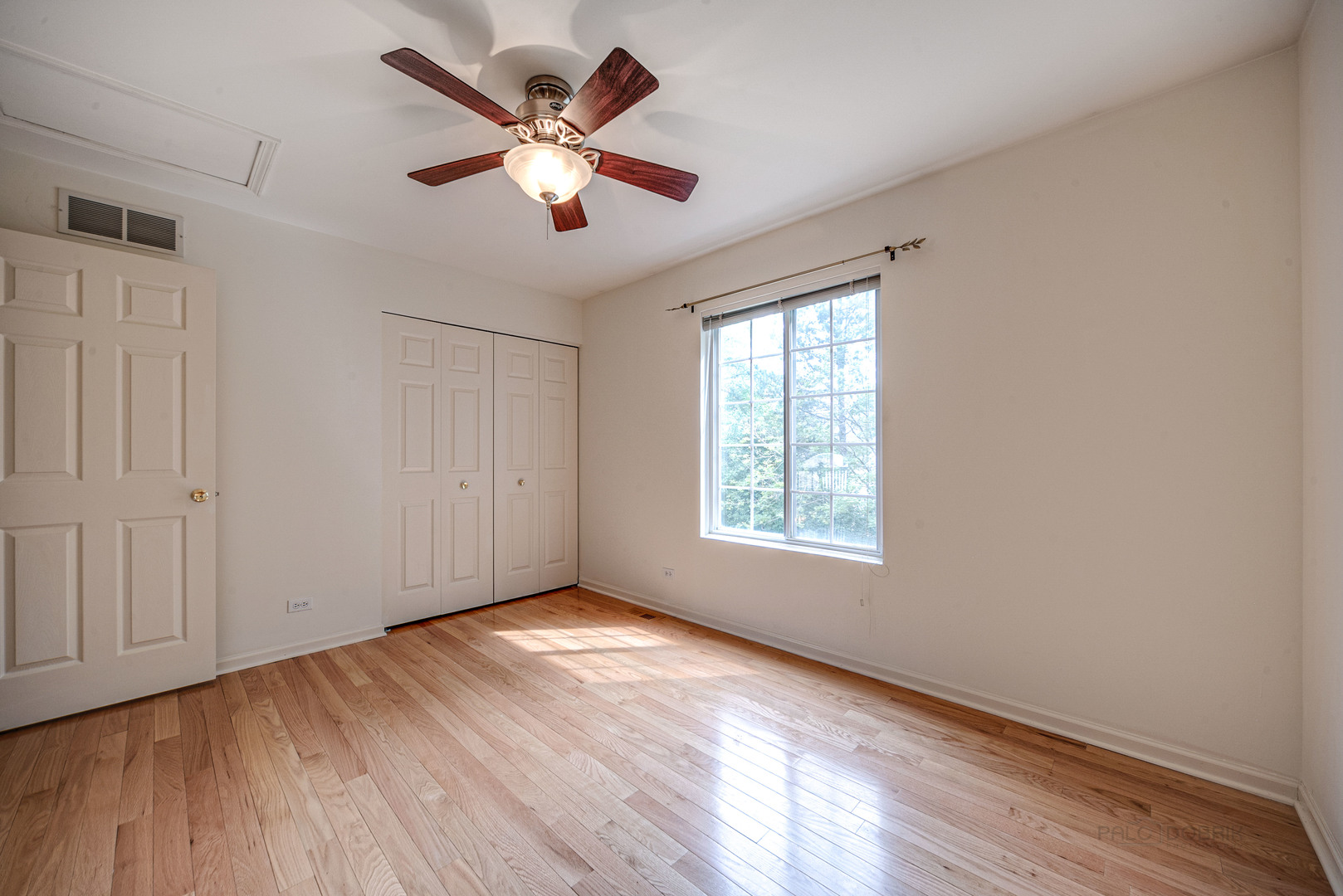 185 Aberdeen Drive Algonquin, IL 60102 - Photo 22 of 36 a view of an empty room with wooden floor and a window