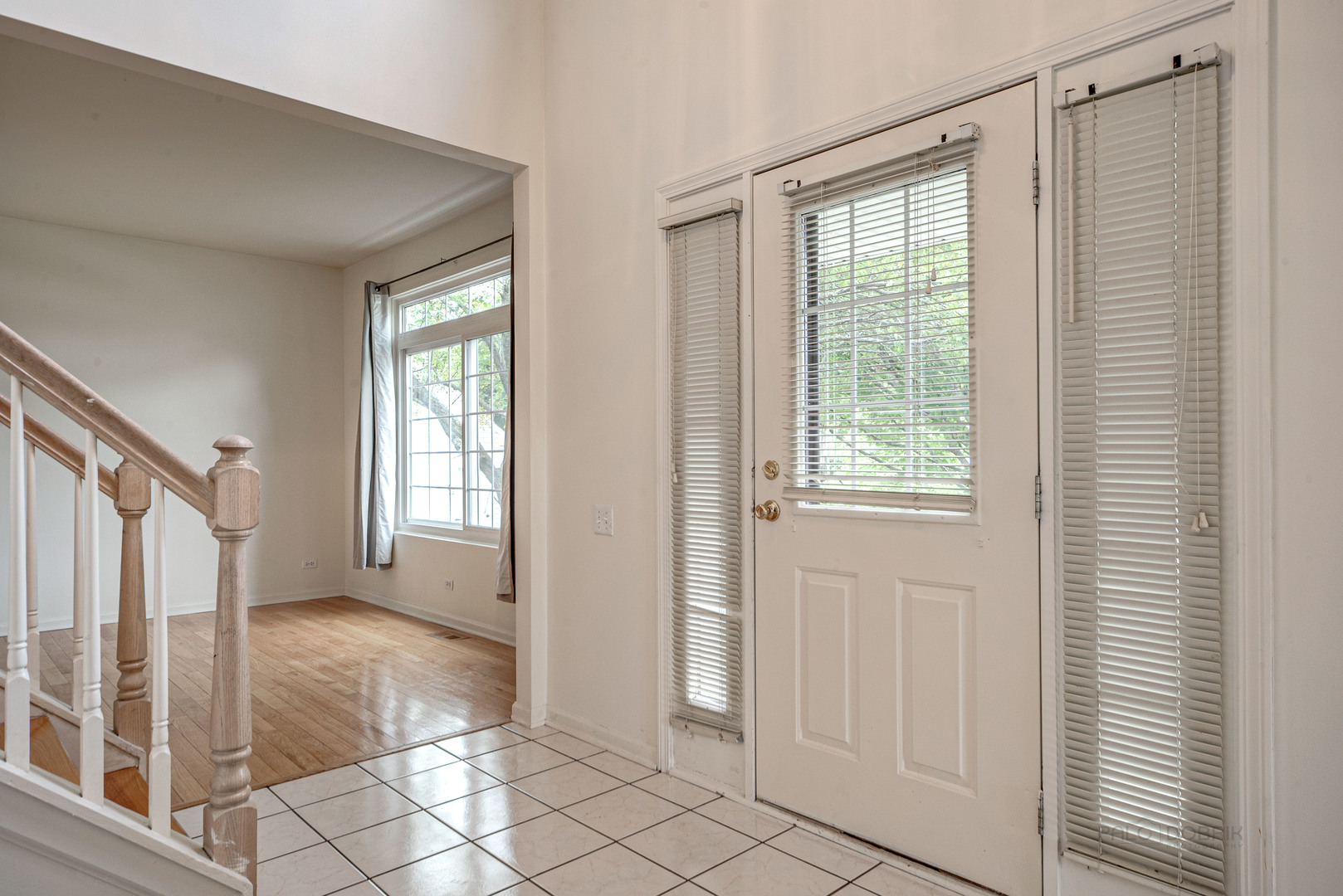 185 Aberdeen Drive Algonquin, IL 60102 - Photo 4 of 36 a view of an entryway with wooden floor and door