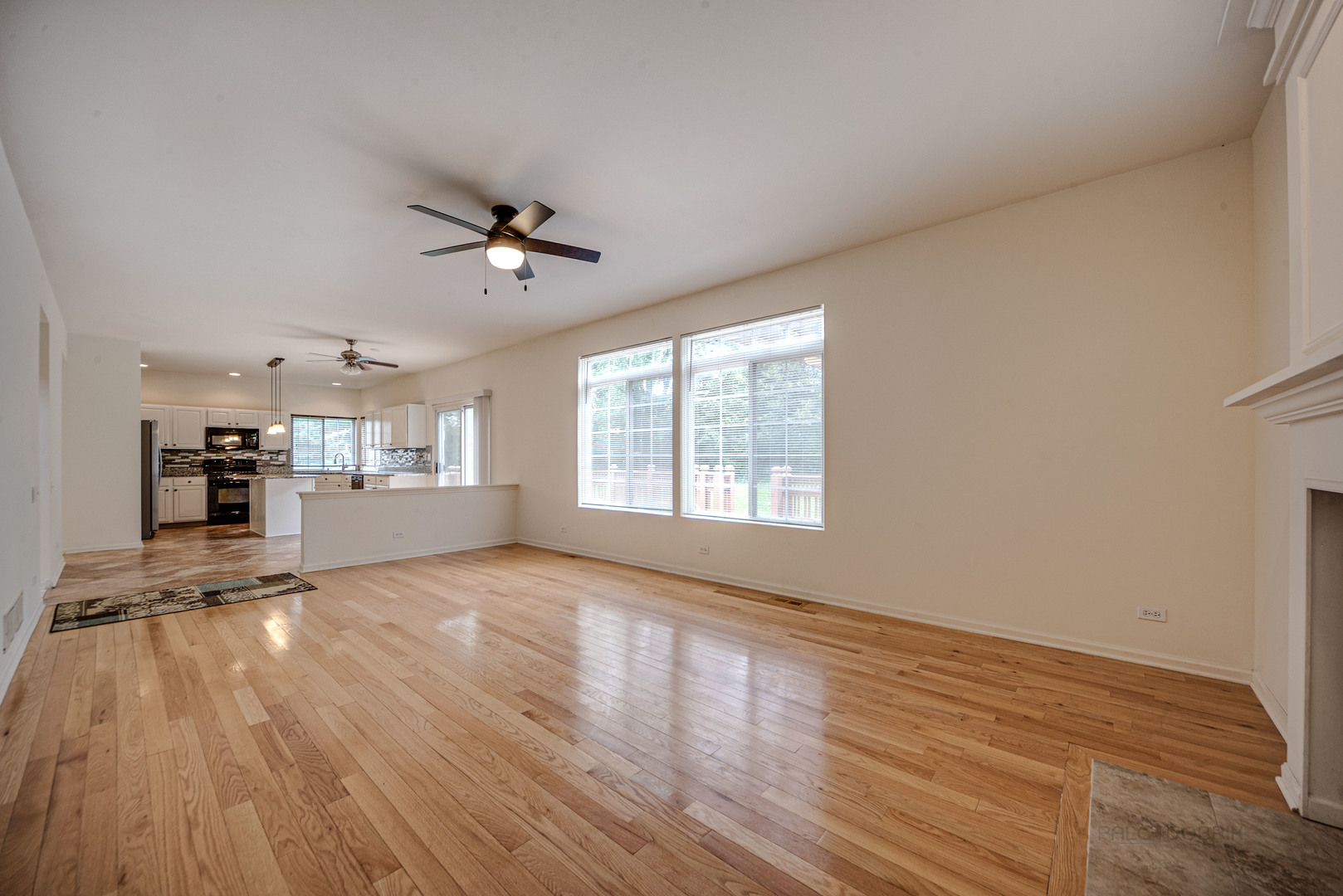185 Aberdeen Drive Algonquin, IL 60102 - Photo 7 of 36 wooden floor in an empty room with a window