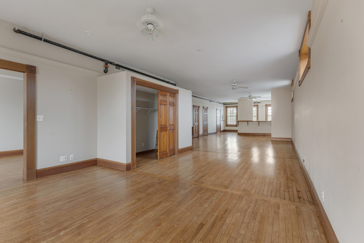 222 West Main Street, Unit A St. Charles, IL 60174 - Photo 12 of 17 a view of an empty room with wooden floor and a window