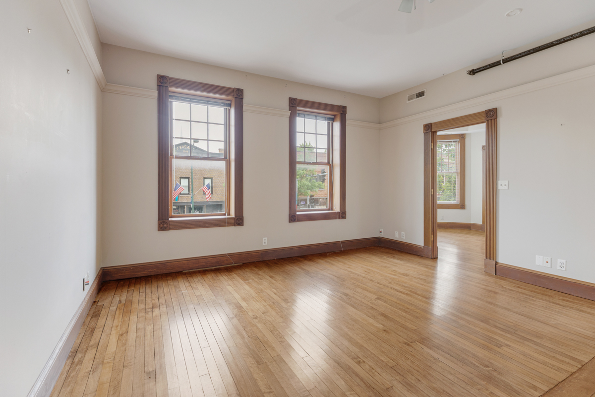 222 West Main Street, Unit A St. Charles, IL 60174 - Photo 13 of 17 an empty room with wooden floor and windows