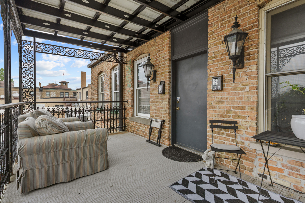 222 West Main Street, Unit A St. Charles, IL 60174 - Photo 3 of 17 a balcony with furniture