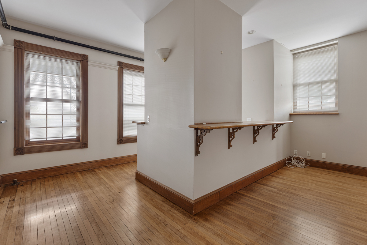 222 West Main Street, Unit A St. Charles, IL 60174 - Photo 6 of 17 a view of a hallway with wooden floor and stairs