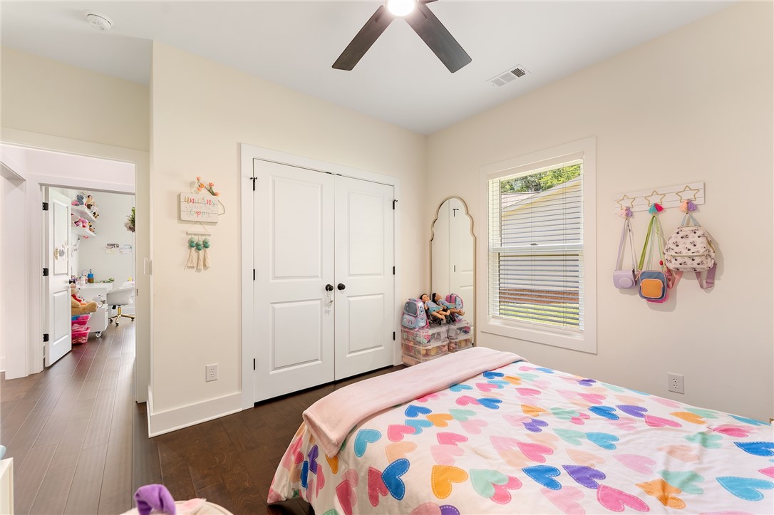 502 Canebrake Drive Anderson, SC 29621 - Photo 32 of 39 This cozy bedroom features hardwood floors and a bright window, creating a serene and inviting atmosphere.