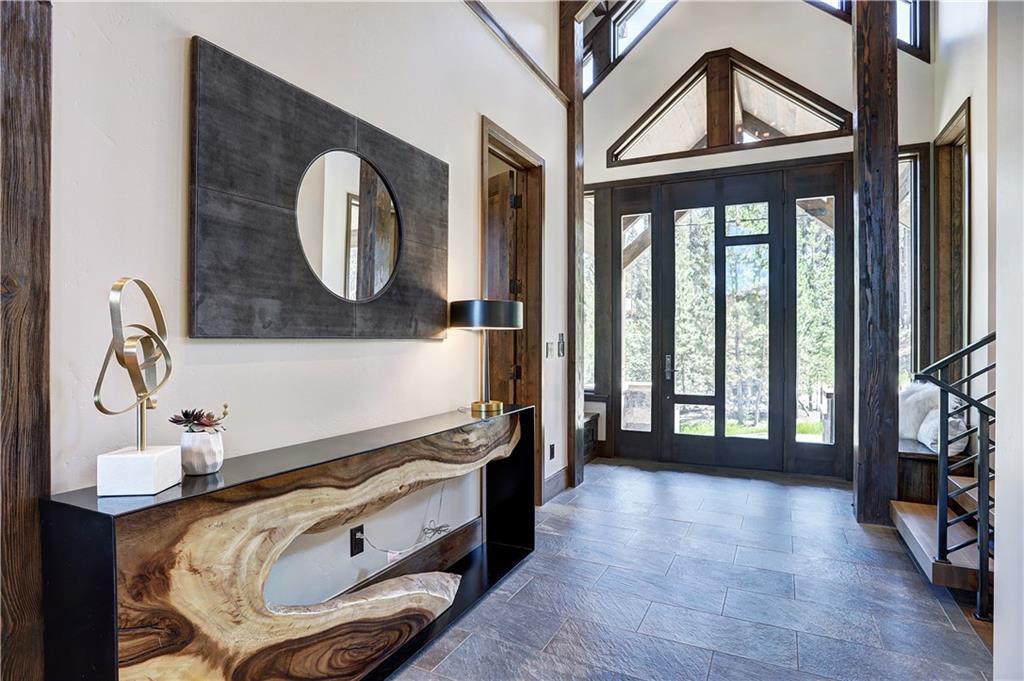 121 Boulder Circle Breckenridge, CO 80424 - Photo 11 of 35 an entryway with wooden floor and a front door