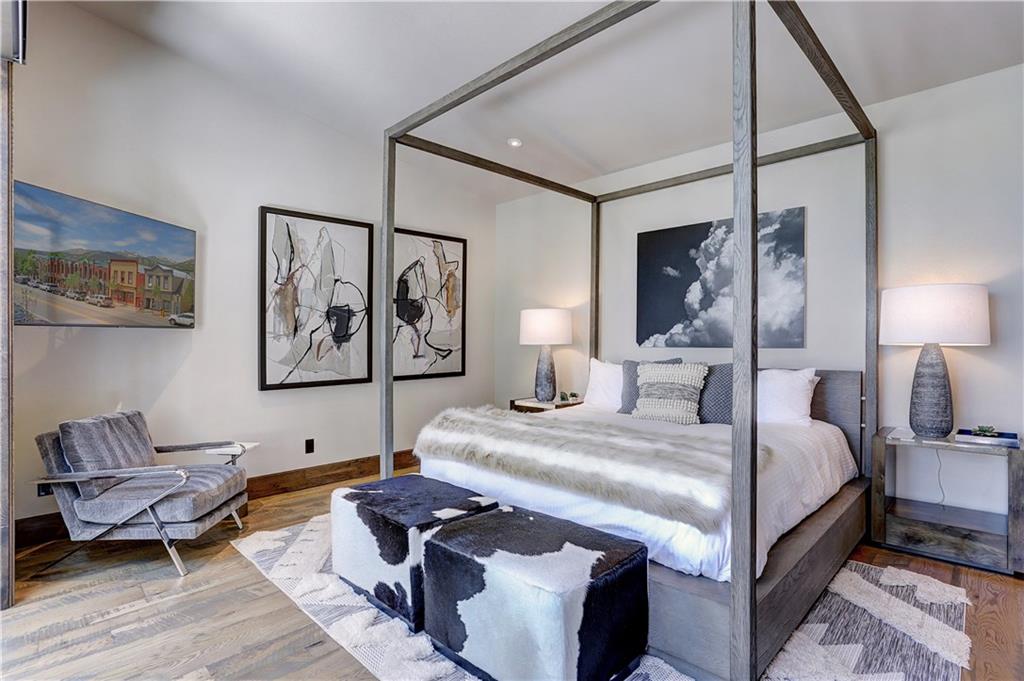 121 Boulder Circle Breckenridge, CO 80424 - Photo 18 of 35 a bedroom with bed couch and window