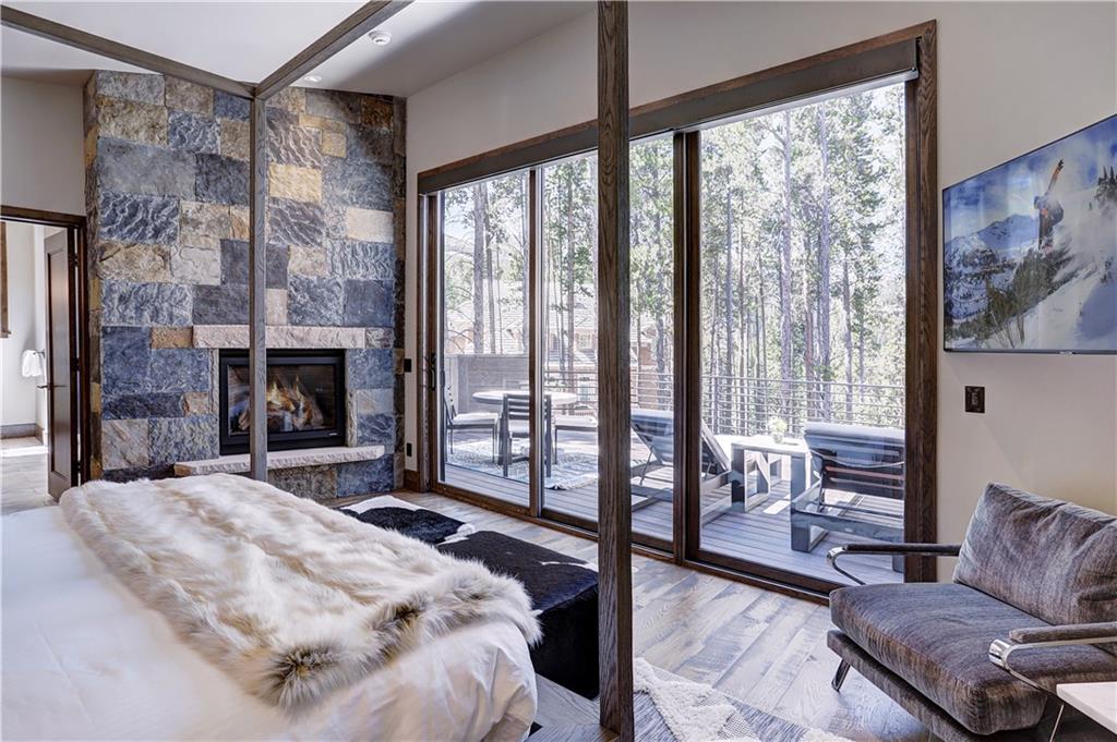 121 Boulder Circle Breckenridge, CO 80424 - Photo 19 of 35 a bedroom with a bed and a fireplace
