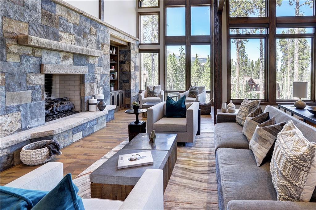 121 Boulder Circle Breckenridge, CO 80424 - Photo 3 of 35 a living room with furniture fireplace and large windows