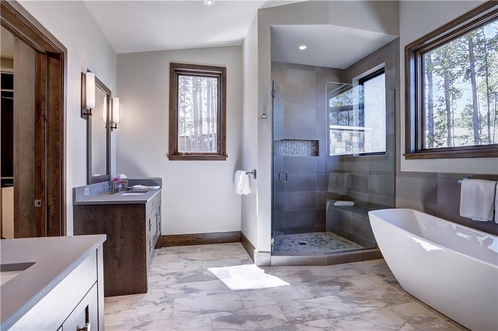 121 Boulder Circle Breckenridge, CO 80424 - Photo 22 of 35 a spacious bathroom with a bathtub sink and toilet
