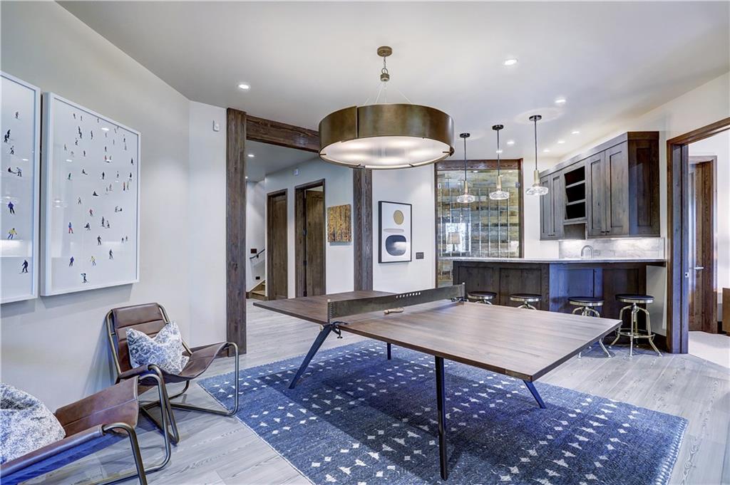 121 Boulder Circle Breckenridge, CO 80424 - Photo 24 of 35 a living room with furniture a table and kitchen view