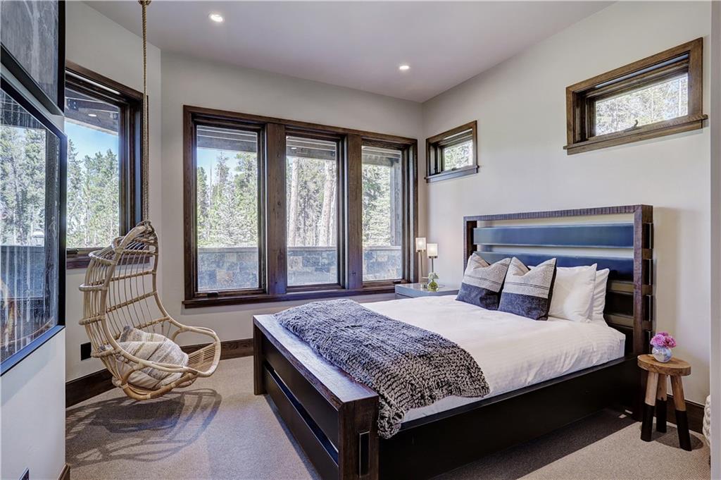 121 Boulder Circle Breckenridge, CO 80424 - Photo 30 of 35 a bedroom with a large bed and a couch