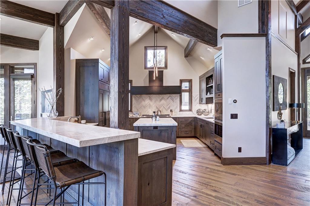 121 Boulder Circle Breckenridge, CO 80424 - Photo 9 of 35 a kitchen with stainless steel appliances granite countertop a stove a sink dishwasher and a refrigerator with wooden floor