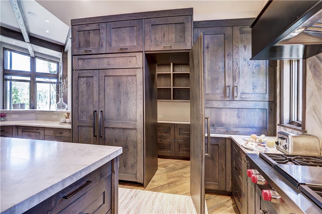121 Boulder Circle Breckenridge, CO 80424 - Photo 10 of 35 a kitchen with stainless steel appliances granite countertop a stove a sink and a refrigerator