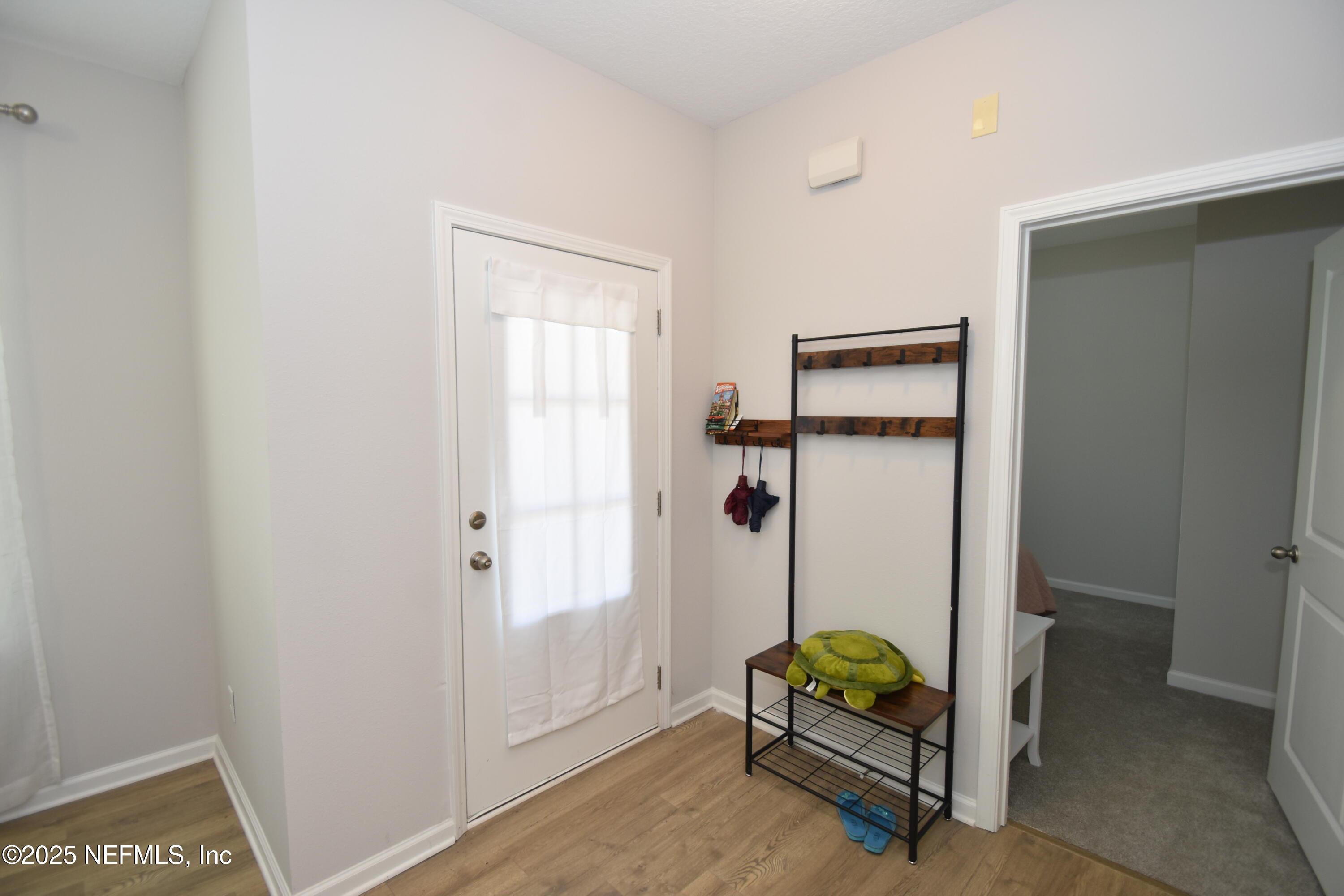 172 Charlie Way St. Augustine, FL 32095 - Photo 4 of 29 a bedroom with a bed and a window