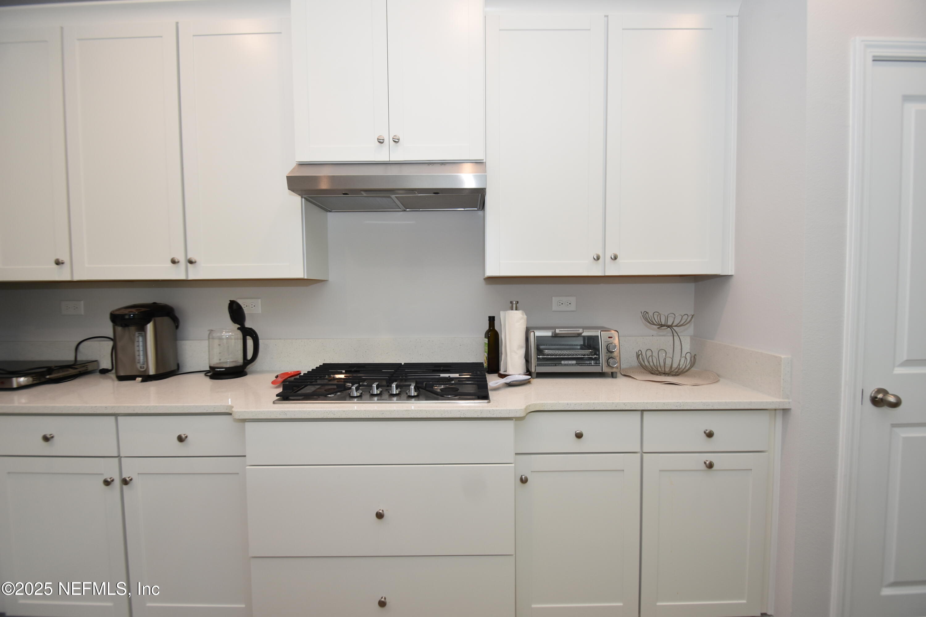 172 Charlie Way St. Augustine, FL 32095 - Photo 7 of 29 a kitchen with granite countertop white cabinets and sink