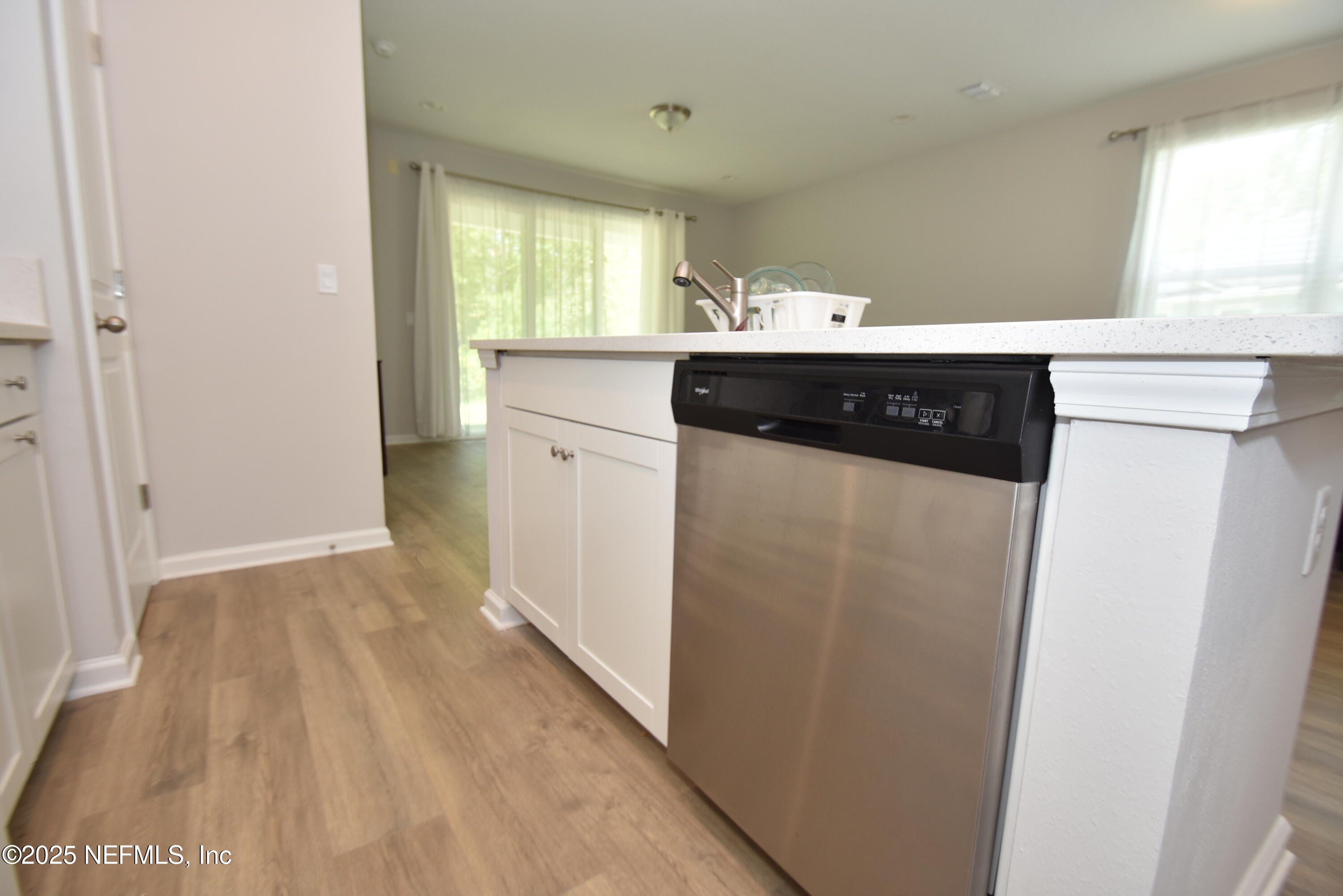 172 Charlie Way St. Augustine, FL 32095 - Photo 9 of 29 a view of a kitchen with a sink and a refrigerator