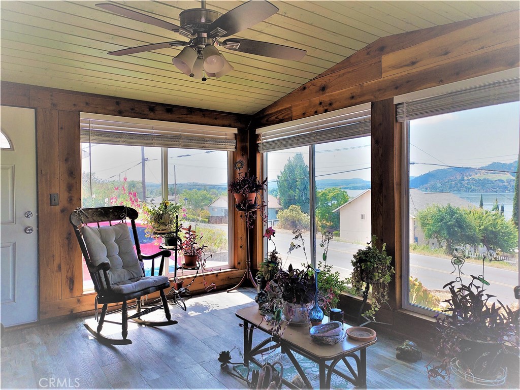 13632 Arrowhead Road Clearlake, CA 95422 - Photo 5 of 28 a living room with furniture and a floor to ceiling window