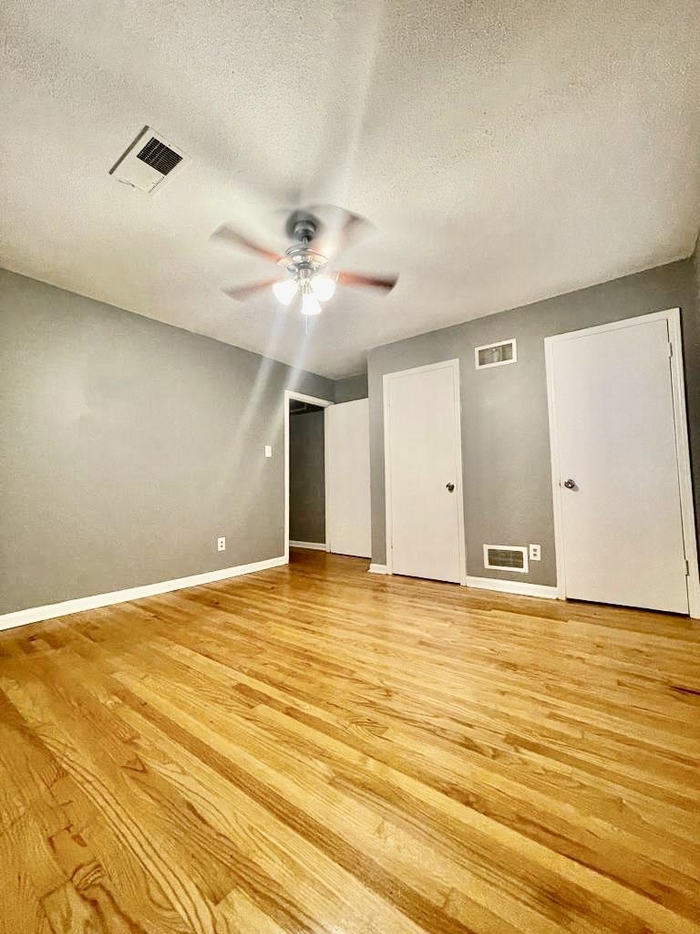 4715 Stage Road Memphis, TN 38128 - Photo 11 of 22 a view of an empty room with wooden floor