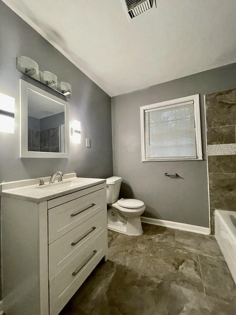 4715 Stage Road Memphis, TN 38128 - Photo 12 of 22 a bathroom with a toilet sink and mirror