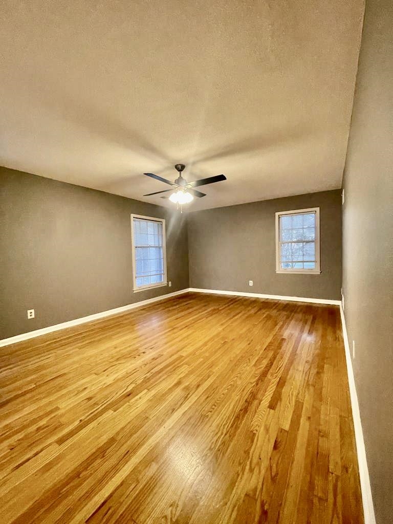 4715 Stage Road Memphis, TN 38128 - Photo 14 of 22 a view of an empty room with wooden floor