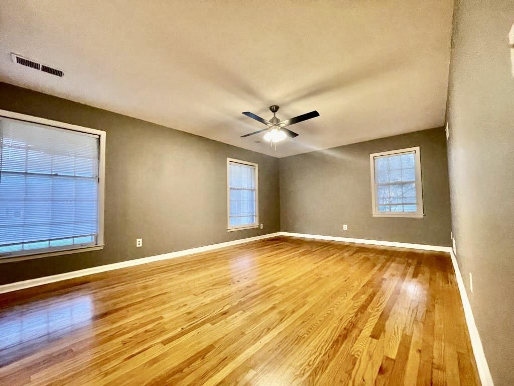 4715 Stage Road Memphis, TN 38128 - Photo 15 of 22 a view of an empty room with wooden floor and a window