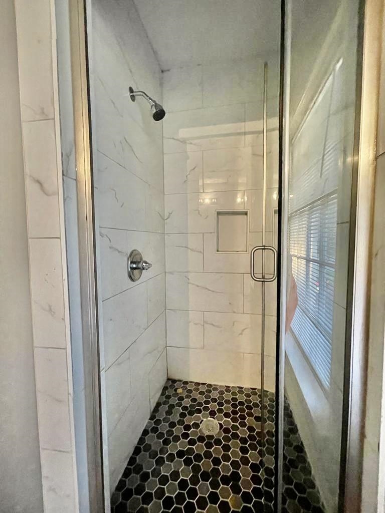 4715 Stage Road Memphis, TN 38128 - Photo 16 of 22 a bathroom with a glass door shower