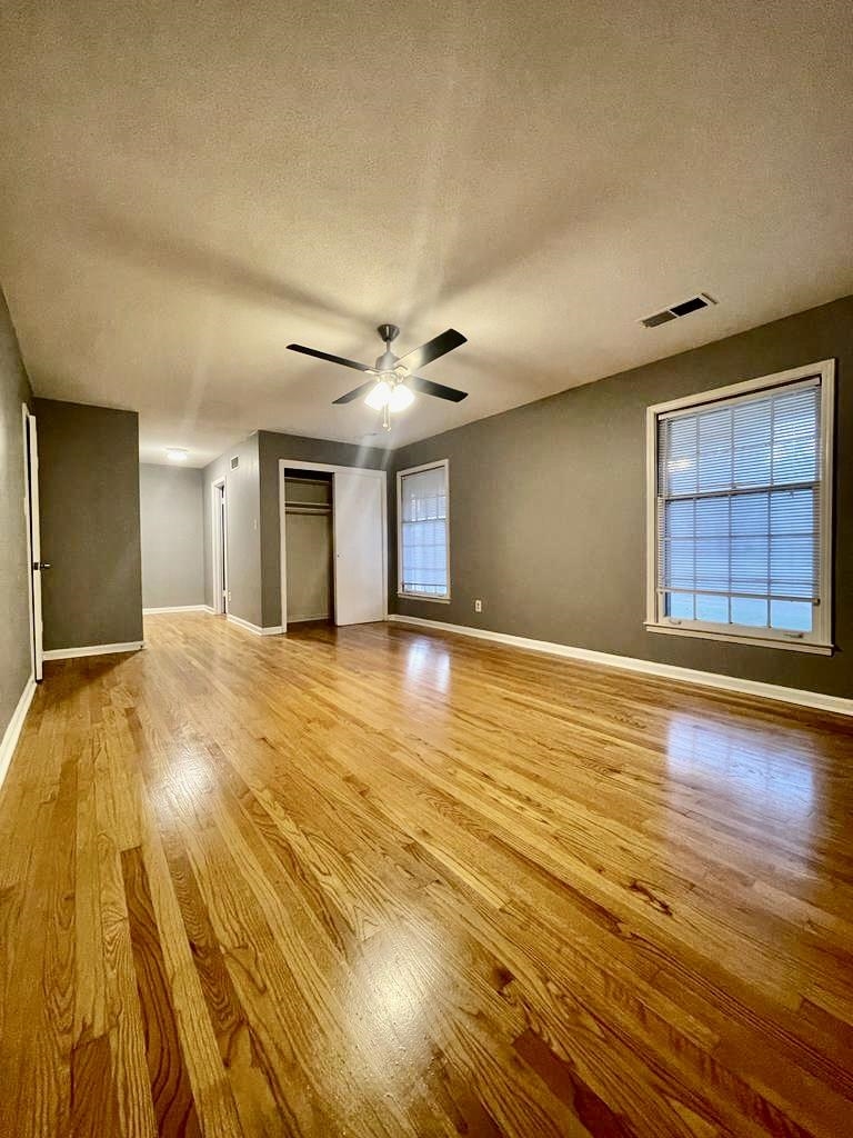 4715 Stage Road Memphis, TN 38128 - Photo 19 of 22 a view of an empty room with window and wooden floor