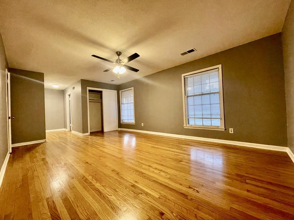4715 Stage Road Memphis, TN 38128 - Photo 20 of 22 a view of an empty room with window and wooden floor
