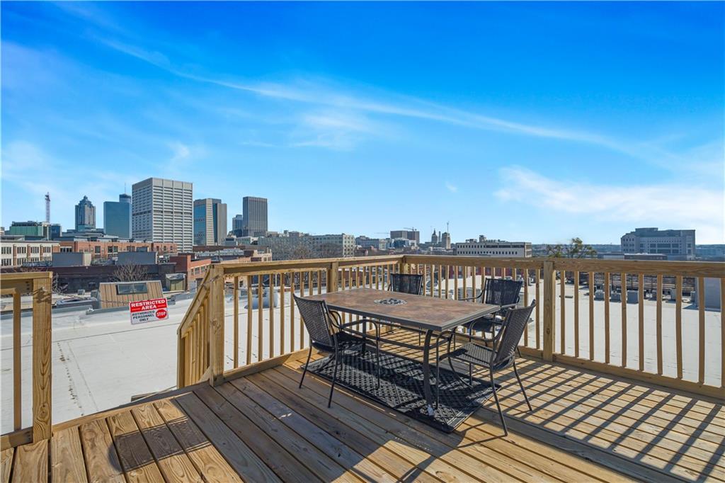 150 Walker Street Southwest, Unit 7 Atlanta, GA 30313 - Photo 15 of 17 a view of roof deck with two chairs and wooden floor