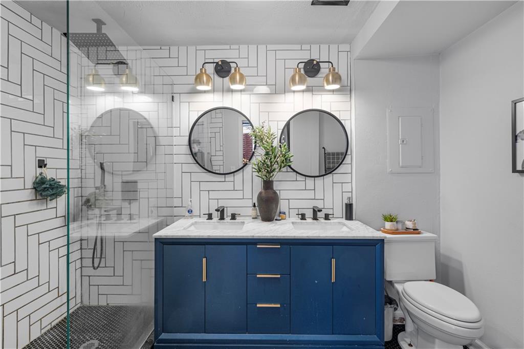 150 Walker Street Southwest, Unit 7 Atlanta, GA 30313 - Photo 5 of 17 a bathroom with a toilet sink and mirror