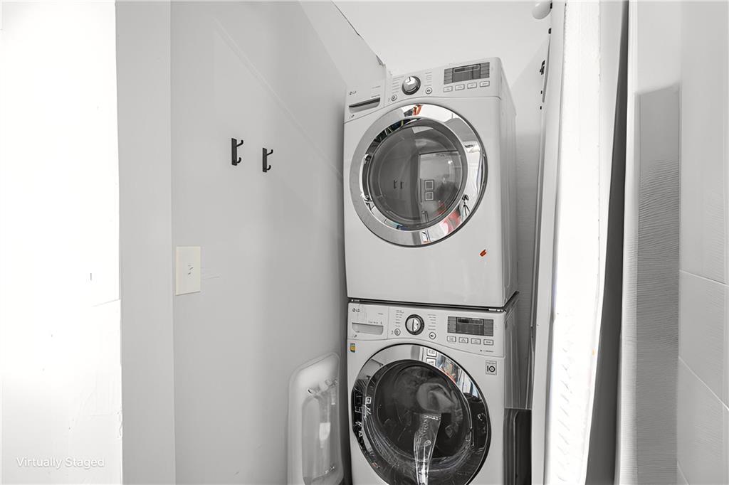150 Walker Street Southwest, Unit 7 Atlanta, GA 30313 - Photo 8 of 17 a view of a hallway with washer and dryer