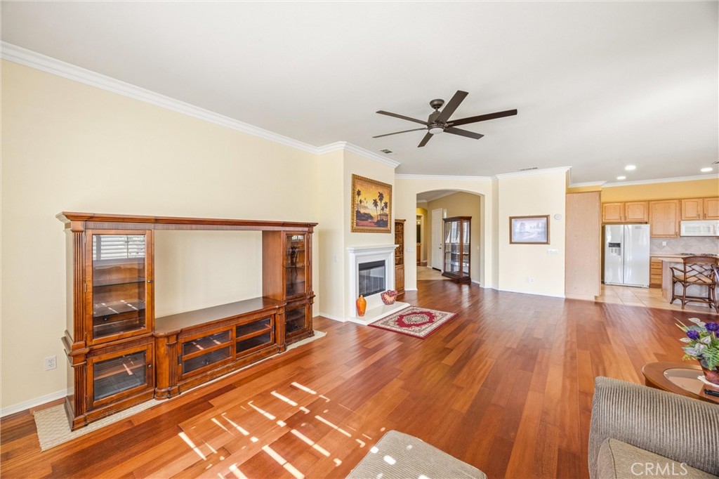1732 Brittney Road Beaumont, CA 92223 - Photo 11 of 54 a living room with furniture a flat screen tv and wooden floor