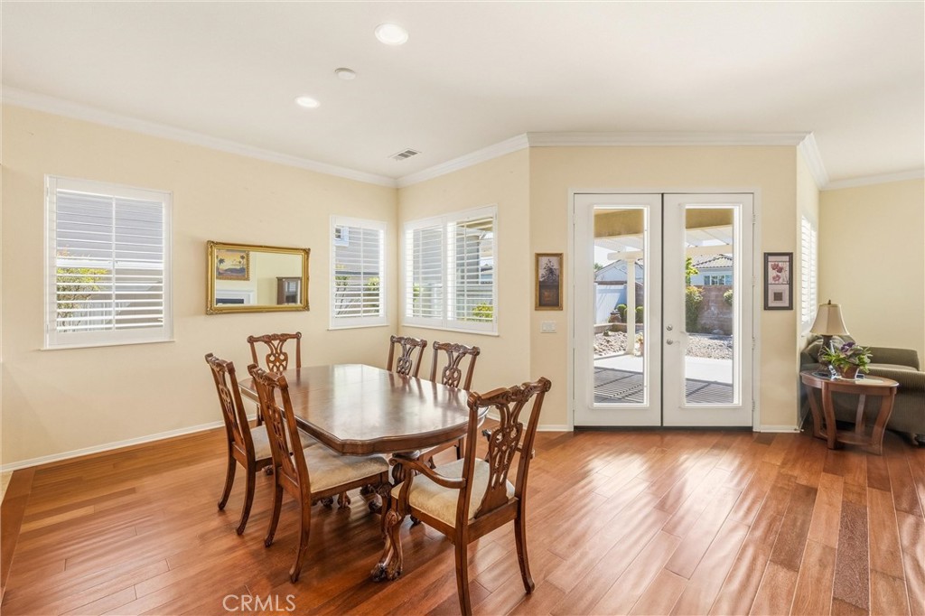 1732 Brittney Road Beaumont, CA 92223 - Photo 13 of 54 a dining room with furniture and wooden floor