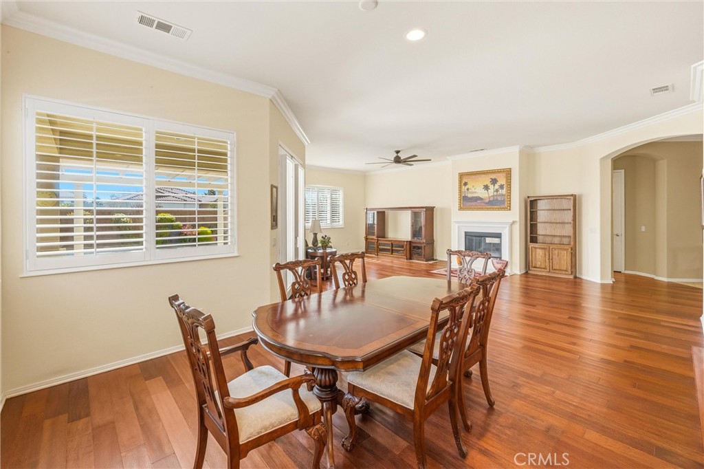 1732 Brittney Road Beaumont, CA 92223 - Photo 14 of 54 a dining room with furniture and wooden floor