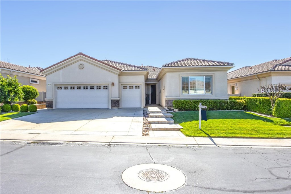 1732 Brittney Road Beaumont, CA 92223 - Photo 2 of 54 a view of a house with a swimming pool and a yard