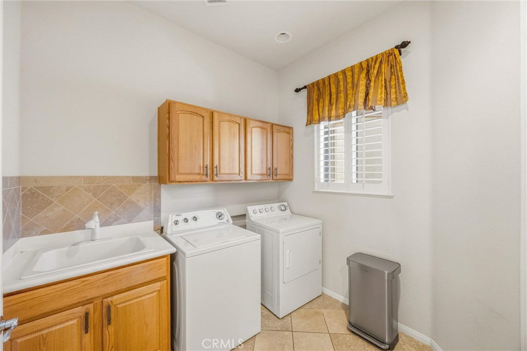 1732 Brittney Road Beaumont, CA 92223 - Photo 21 of 54 a utility room with dryer and washer