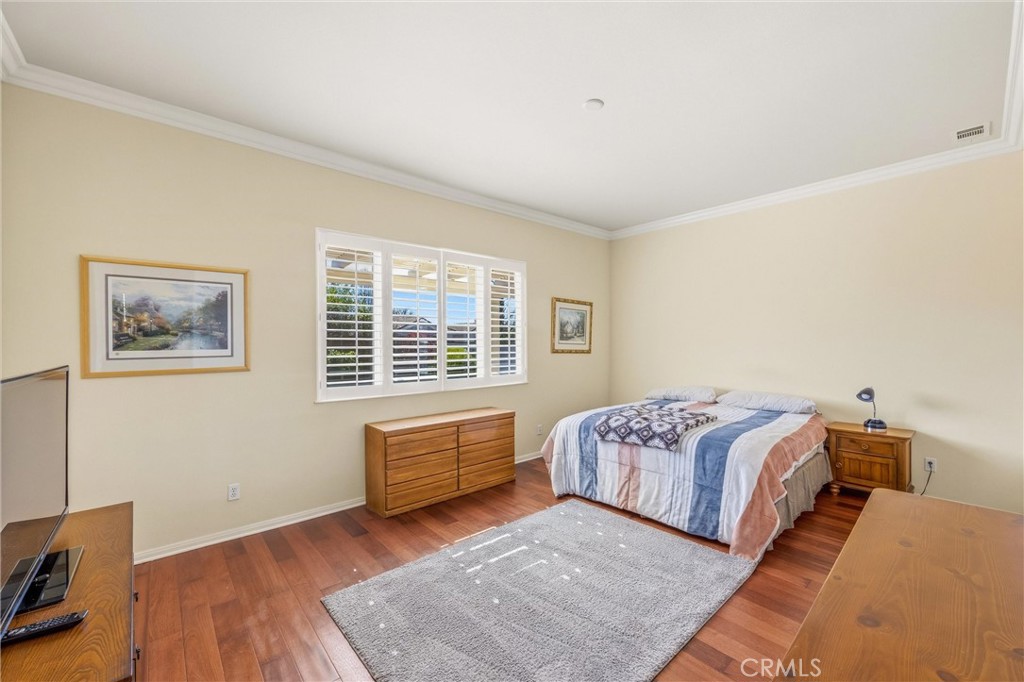 1732 Brittney Road Beaumont, CA 92223 - Photo 22 of 54 a bedroom with double bed and a window