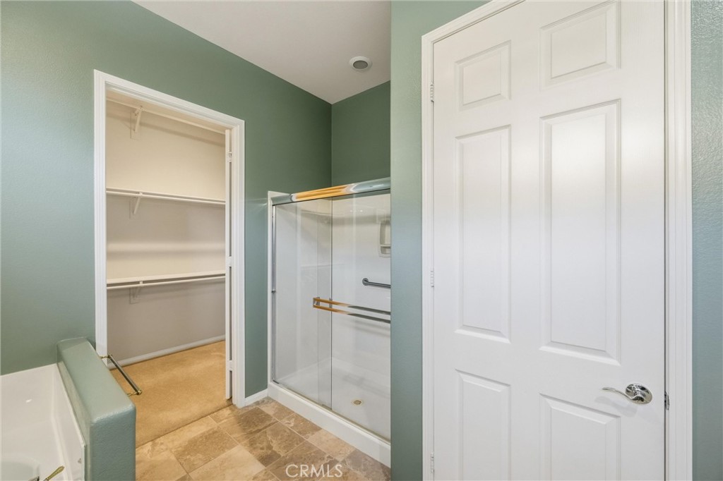 1732 Brittney Road Beaumont, CA 92223 - Photo 26 of 54 a bathroom with a shower and a glass door