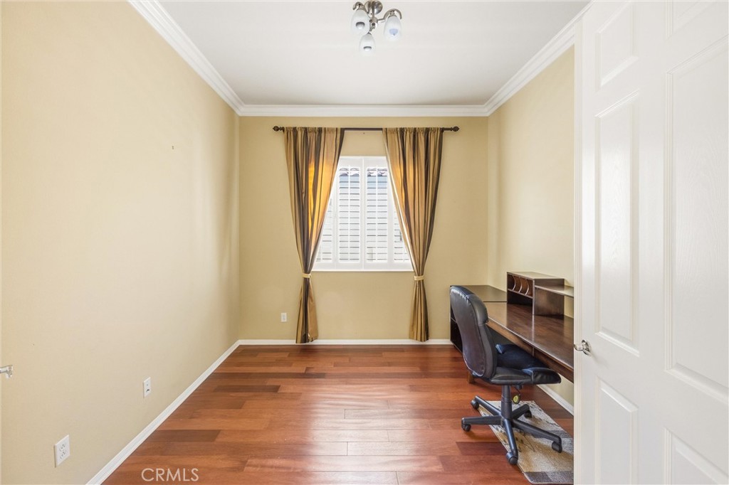1732 Brittney Road Beaumont, CA 92223 - Photo 28 of 54 a view of a workspace with furniture and a window