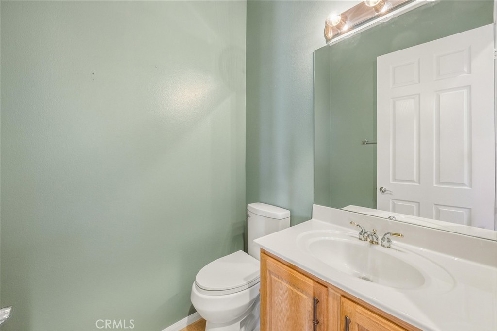 1732 Brittney Road Beaumont, CA 92223 - Photo 30 of 54 a bathroom with a sink and a toilet