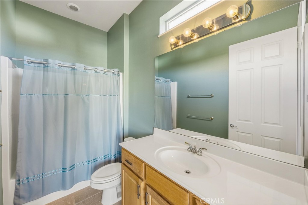 1732 Brittney Road Beaumont, CA 92223 - Photo 32 of 54 a bathroom with a sink a toilet and shower