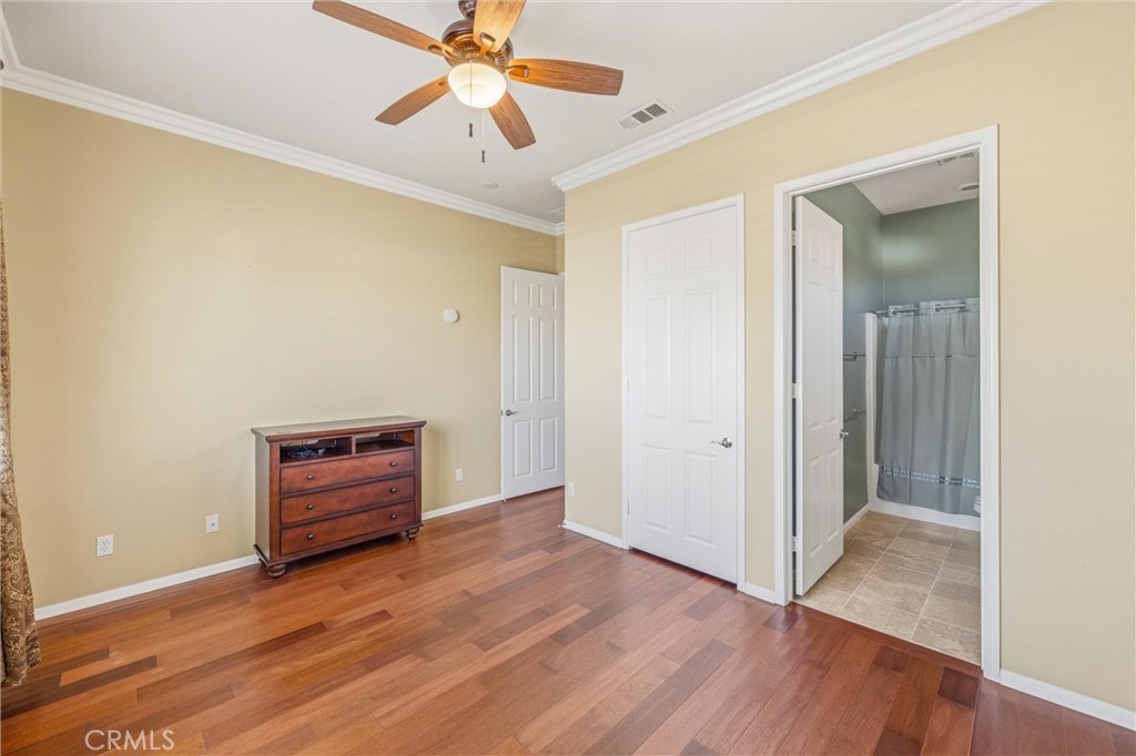 1732 Brittney Road Beaumont, CA 92223 - Photo 34 of 54 a view of room with hardwood floor and ceiling fan