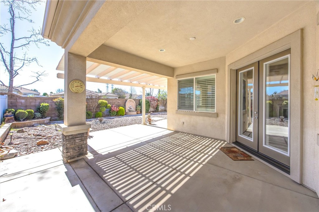 1732 Brittney Road Beaumont, CA 92223 - Photo 36 of 54 a bedroom with a bed and a large window