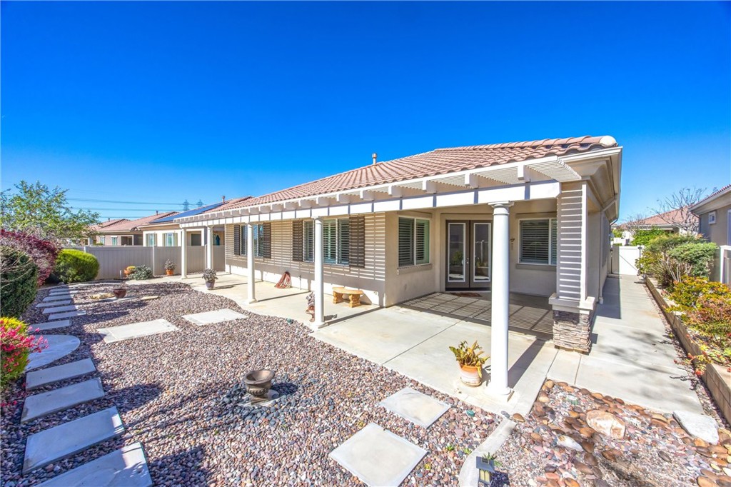 1732 Brittney Road Beaumont, CA 92223 - Photo 37 of 54 a view of house with backyard porch and sitting area