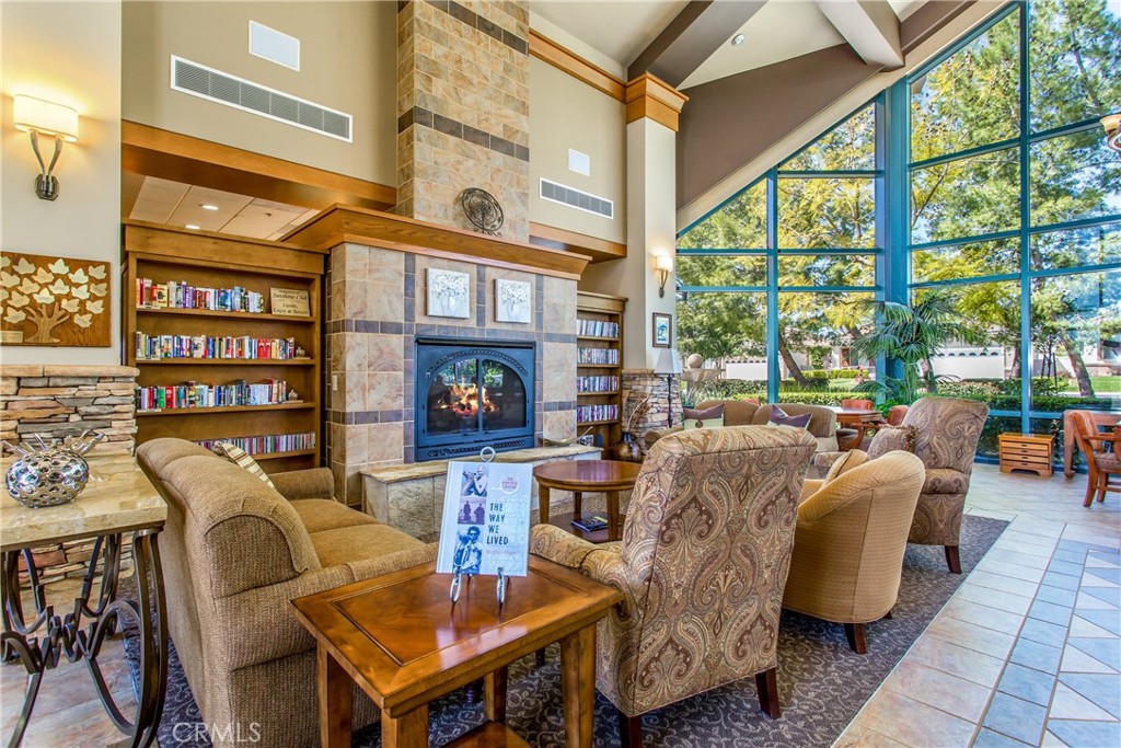1732 Brittney Road Beaumont, CA 92223 - Photo 44 of 54 a living room with fireplace furniture and a floor to ceiling window