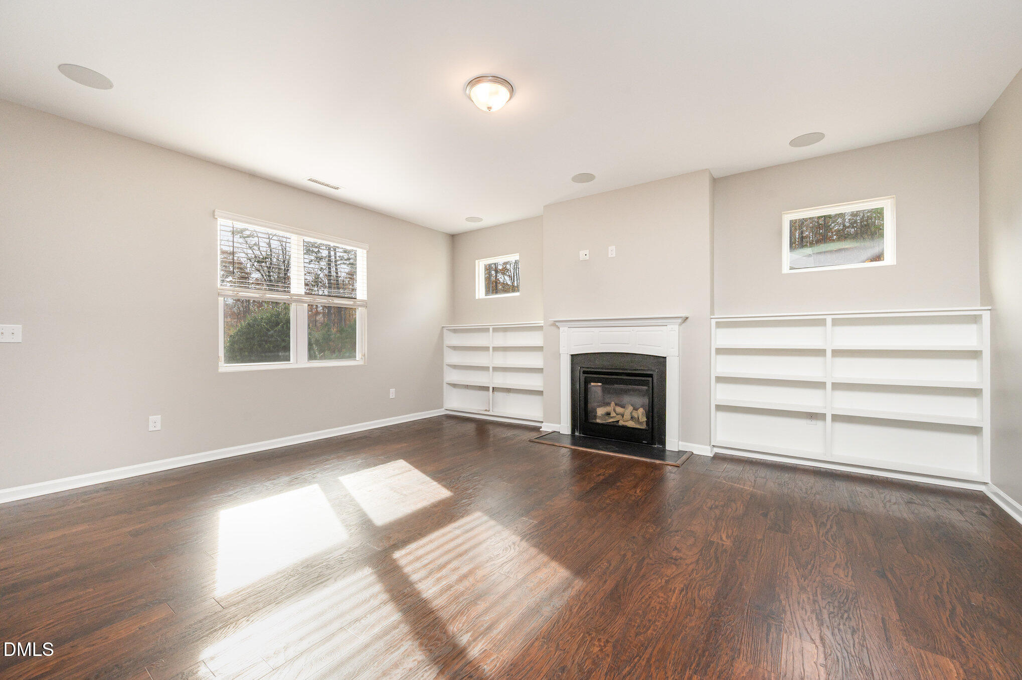 18 Dover Ridge Court Chapel Hill, NC 27517 - Photo 12 of 40 a view of an empty room with a window and fireplace