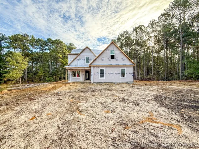a house with trees in the background