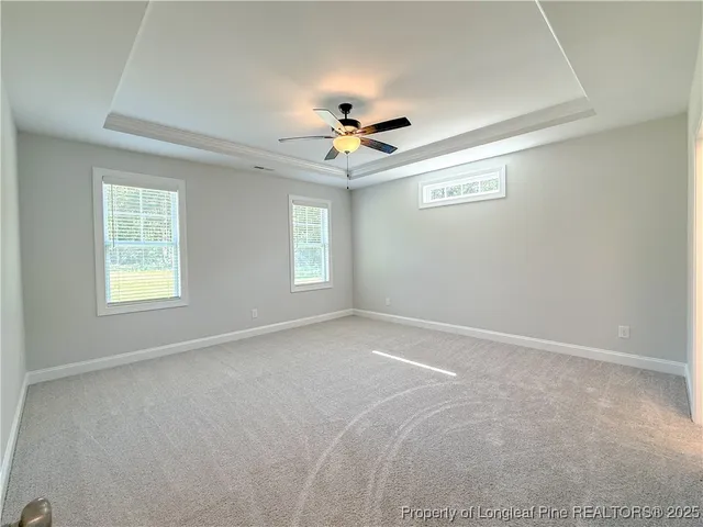 a bathroom with a granite countertop sink toilet mirror and bathtub