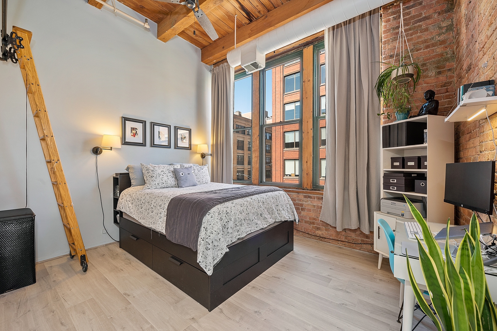 331 South Peoria Street, Unit 303 Chicago, IL 60607 - Photo 14 of 25 a bed room with a bed and a flat tv screen