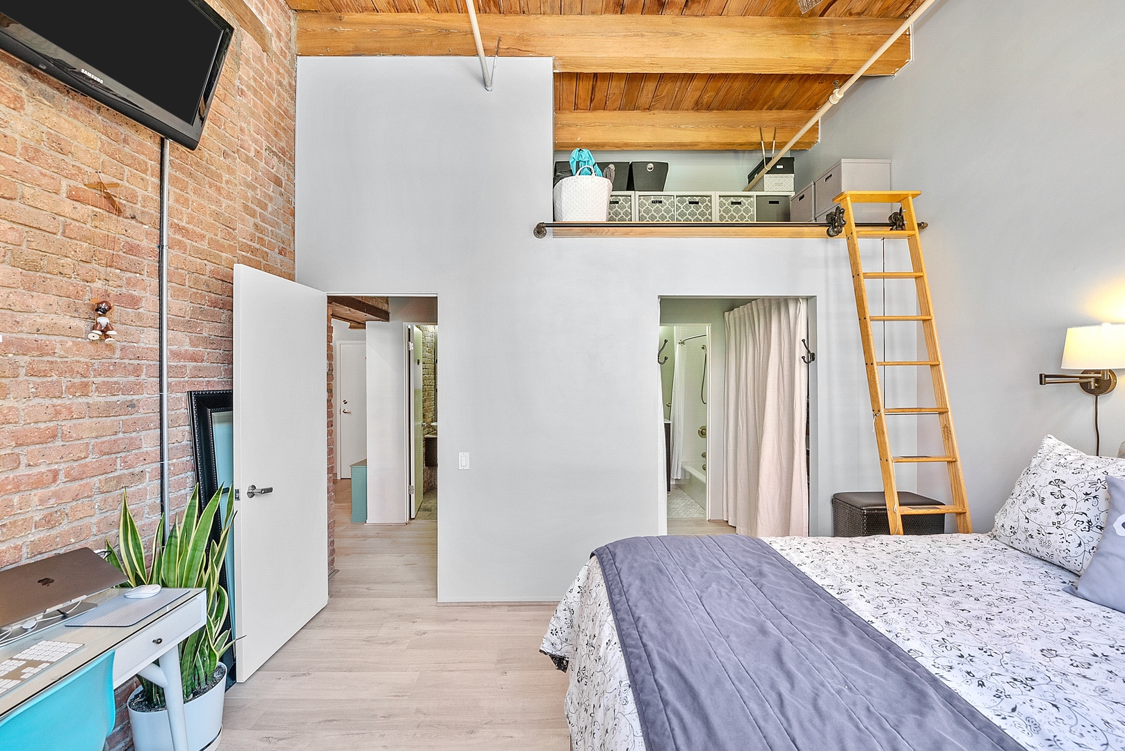 331 South Peoria Street, Unit 303 Chicago, IL 60607 - Photo 15 of 25 a bedroom with a bed and a window